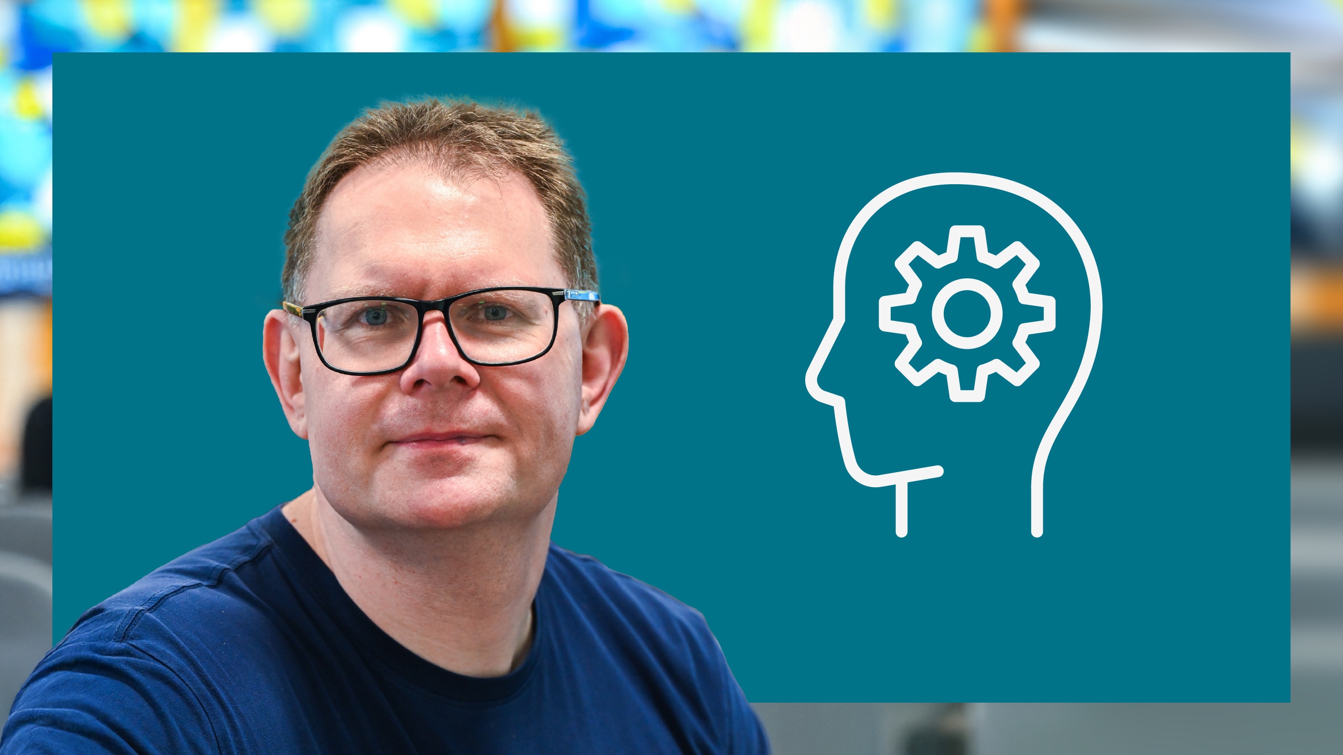 Garth smiling with icon of brain and cog