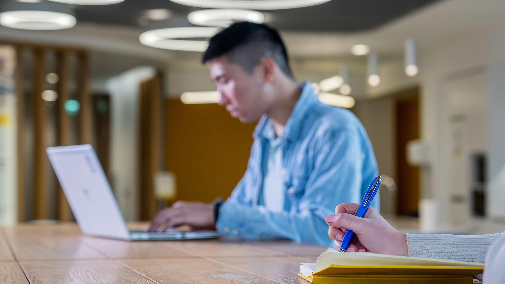 Person typing on laptop